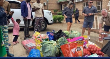 Residents organise food and other donations for Plastic View informal settlement after the fire.
