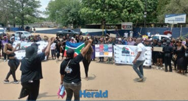Community members march against GBVF.