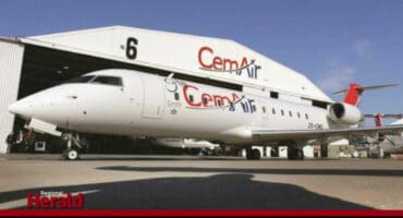 A CemAir plane outside its hanger.