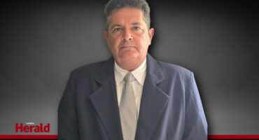 FF Plus coucillor Wayne Kurten, in front of a grey background.