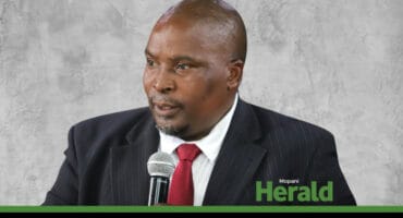 MPAC chairperson Eric Makondo presents his report.