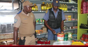 The police check for expired food items.