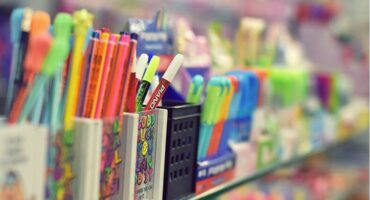 Stationery lined up on shelves.