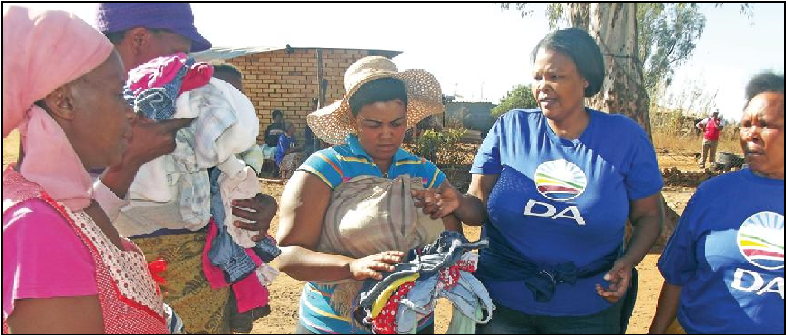 Tshidi Ramodupi hands out clothes to the Mantariana community.