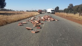 Accident scene involving truck with wooden blocks