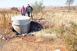 Messrs Carlos Rebelo and Gary Isherwood at the huge valve from which water was still gushing on Monday morning.