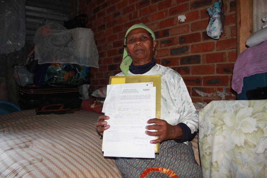 Ms. Nomavu Msomi in the shack where she stays.