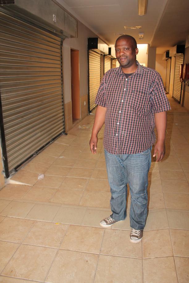 Mr Themba Wisani, photographed here while pointing out problems at a new business development centre in 2014. Work to complete the centre has only continued recently.