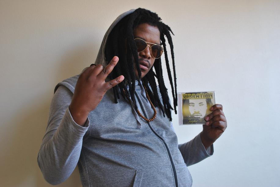 Vibration Taylor with his latest mixtape at hand