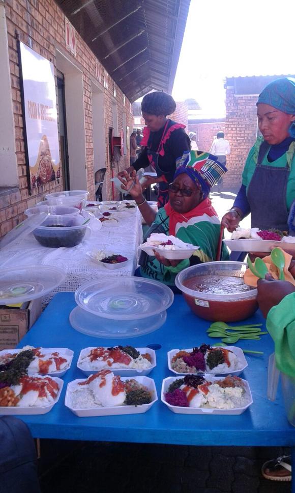 The pensioner Deborah Madolo dishing food