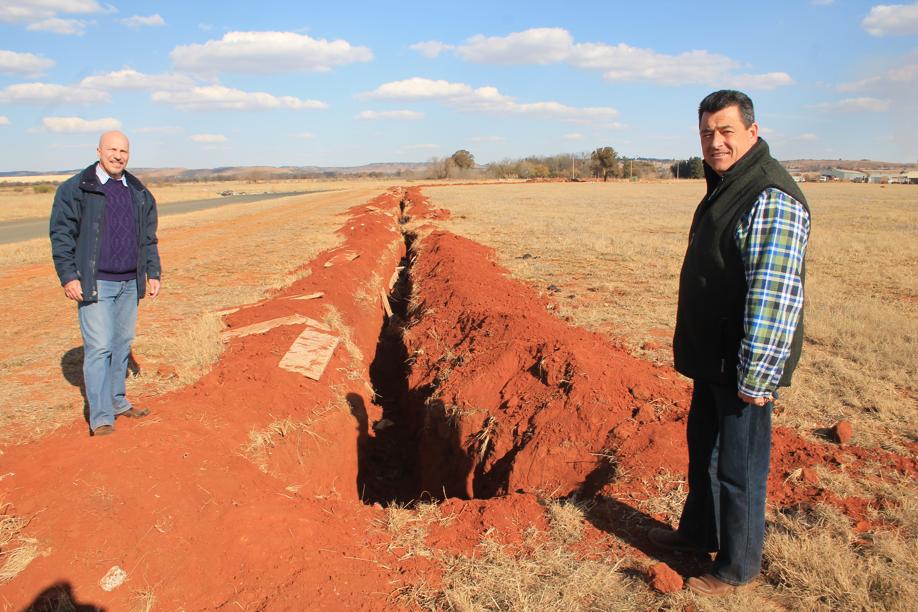 Messrs. Carlos Rebelo and Gary Isherwood at the site where a part of the the electrical cable had been stolen again.