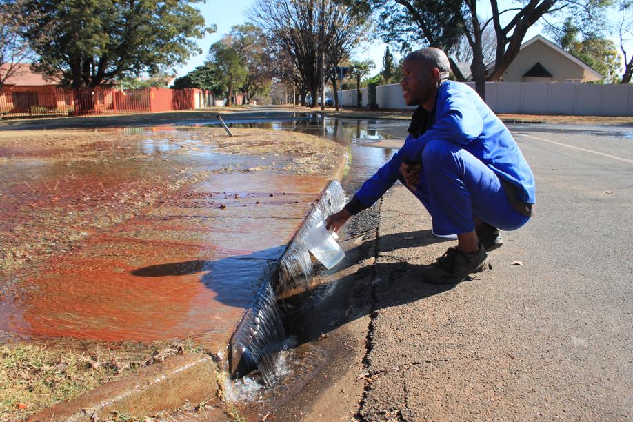 Mr Johannes Sekano, an employee at a house close to the Juliana Street leak that has been left without water, was one of several residents who had to scoop up leaking water as there was no water in the taps