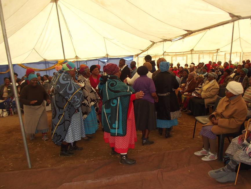 This group of cheerful senior citizens entertained guests with singing and dancing.
