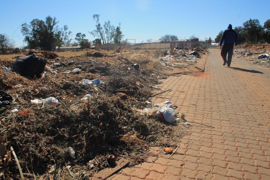Some of the rubbish lining the path to the rubbish transfer station's entrance.