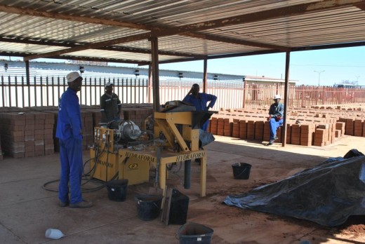 Workers and machinery of brick making 