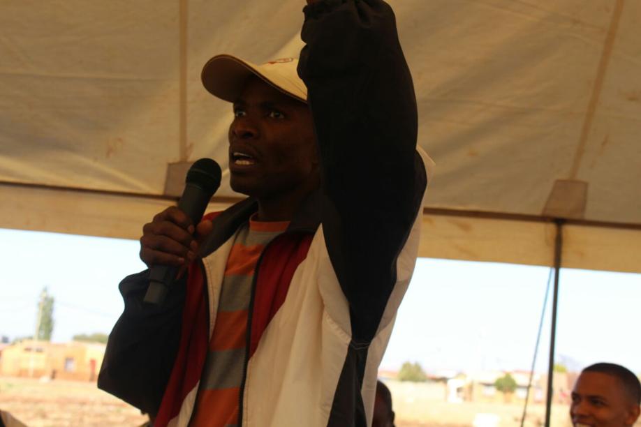 Mr Less Tumo addressing the community
