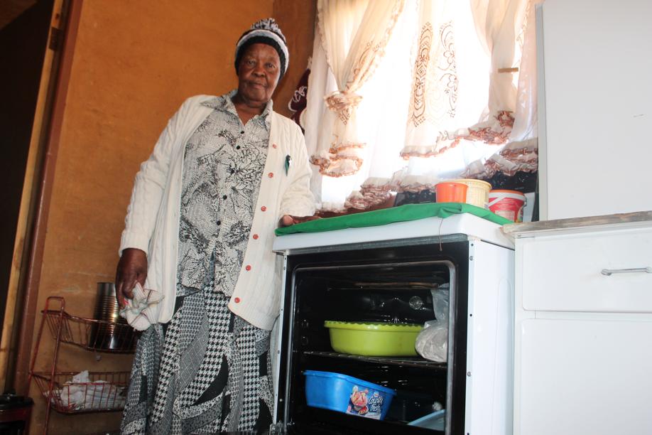 As there is no electricity in the house, Ms Paulina Moenda, has to use her oven as a storage space.