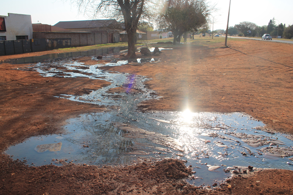 Some of the sewage leaking out on the sidewalk.
