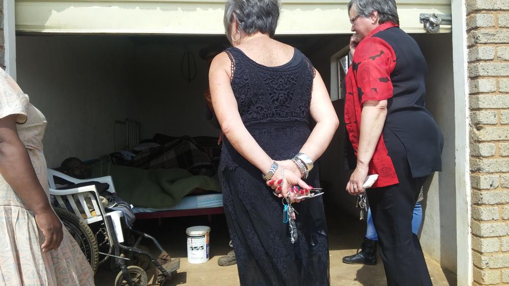 The two councillors, Ms Annett Venter and Alme Zwart looking at the patients being kept in the garage.