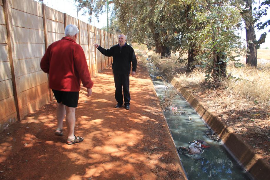 The storm water channel is filled with sewage.
