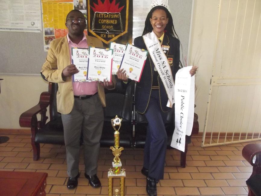 Mr Zwelihle Magwijana, the principal of Letsatsing Combined School and the beautiful model, Lesego Mashigo.