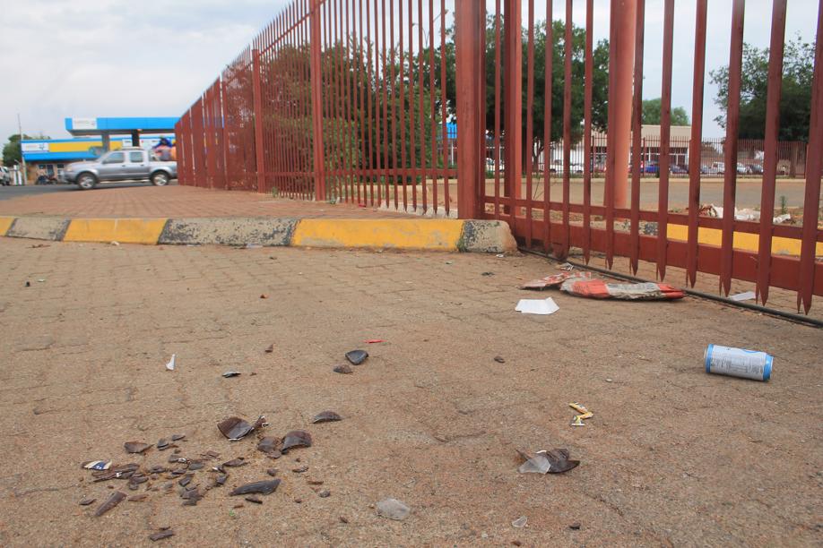 Some pieces of broken bottle were still left outside the facility on Monday afternoon.