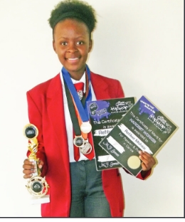 Refilwe Mohasi with her trohies and certificates from previous competitions