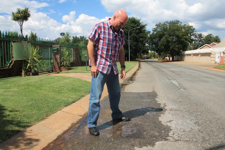 Mr Carlos Rebelo at the water leak in Joubert Street that was still running this week.