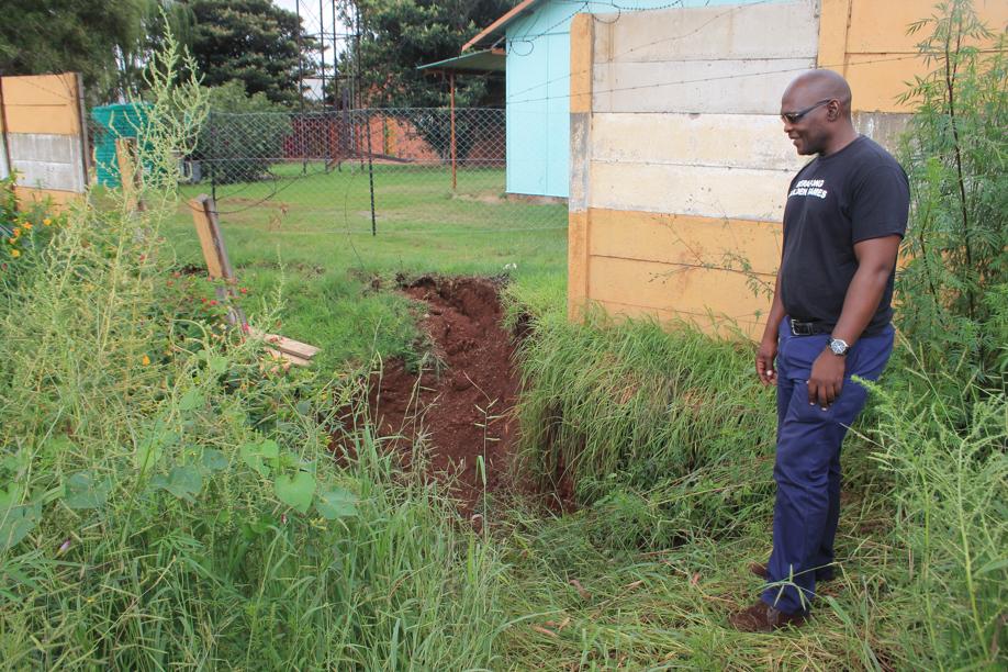 A community leader, Mr Vusi Mcunana, next to the sinkhole.