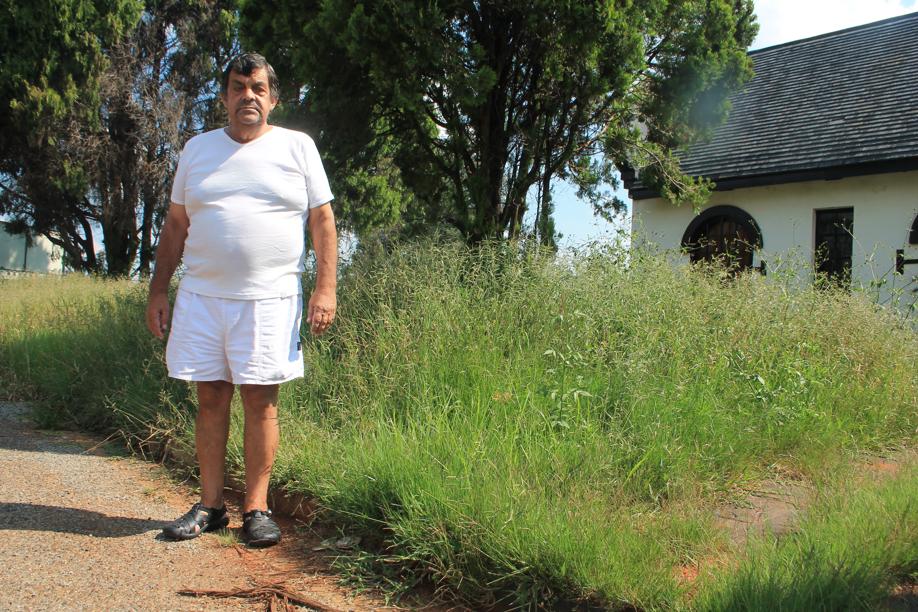 Mr Stan Burger wants help to cut tall grass such as this in the Carletonville Graveyard.