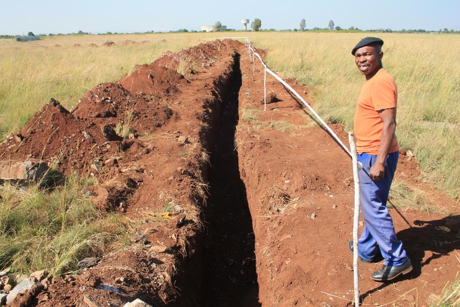 A resident of Khutsong Extension 3, Mr Steven Mbilini, at the site of the new reservoir.