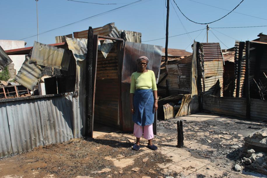 Rose Kakue at the burnt shack