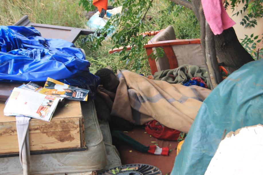 One of the recyclers taking a nap near the facility's entrance.