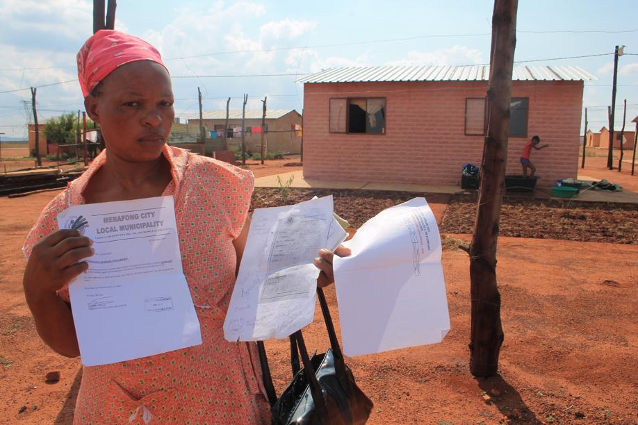Ms Nomali Mpanza in front of her house which has been taken over by another family.