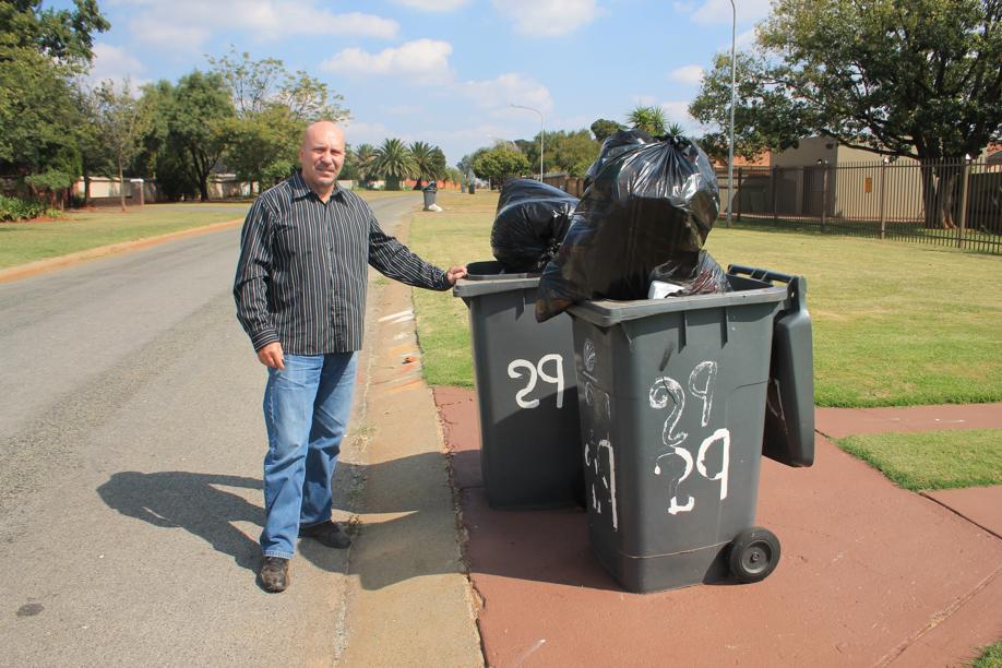A councillor, Mr Carlos Rebelo, with some rubbish that were not removed on Monday.