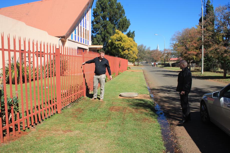 Messrs. Devin Nieuwenhuyzen and Carlos Rebelo at the leak at the church in Limonite Street.