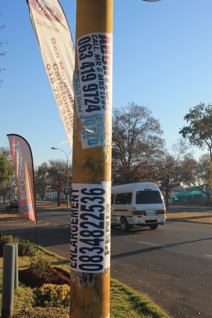 Illegal posters such as these, stuck on the pole of a traffic light in Kaolin Street, will soon be a thing of the past if the municipality has its way.