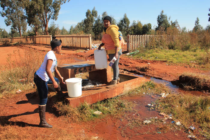 Many residents fetch free water from the site of the leak.