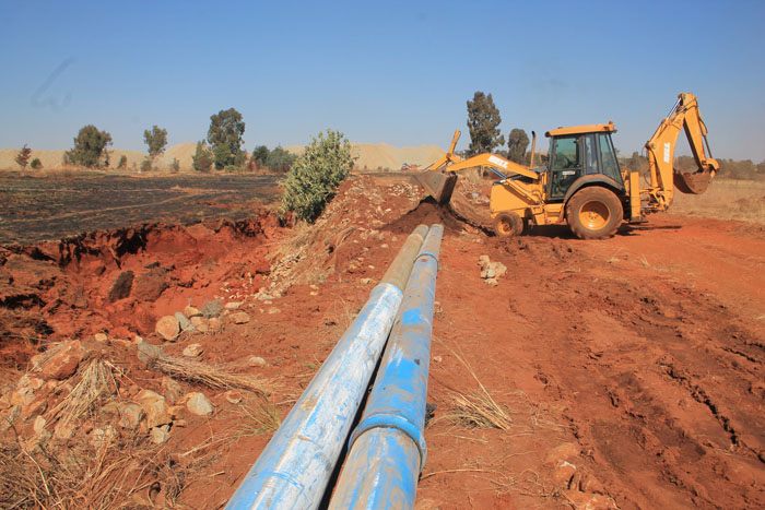 The sinkhole next to a pipe near Doornfontein was being filled up on Monday.