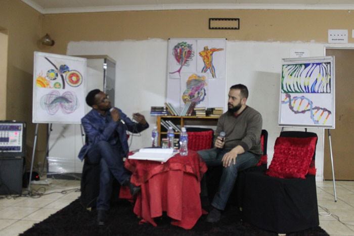 The talk show host, Mr Sakhile Mthembu talking to one of last Friday's guests, Mr Rudi Santana.