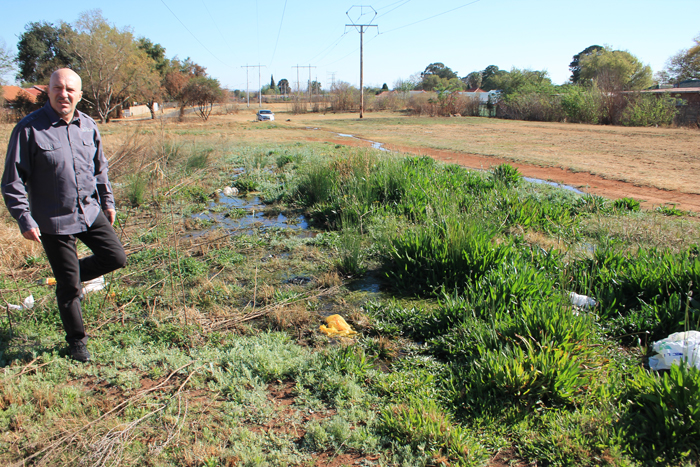 Mr Carlos Rebelo points to where the leaking water has spread to a larger area under the pylons.