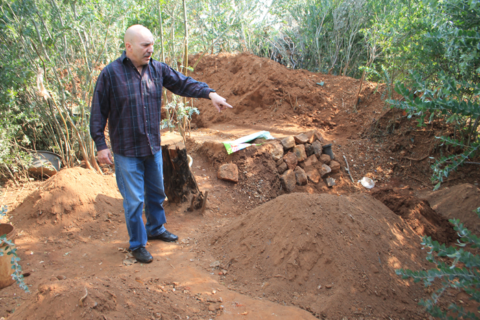 Mr Carlos Rebelo at the abandoned workings of the illegal miners.