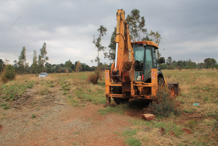 A municipal machine stood at the site where workers were digging on Sunday afternoon to try and restore the water supply to Welverdiend.