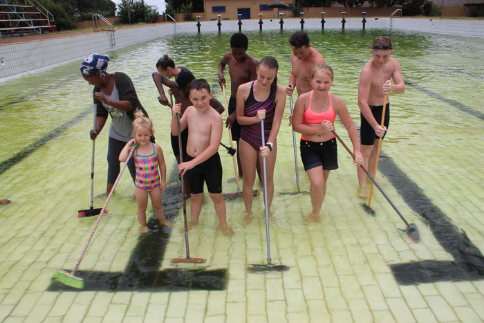Some of the group of swimming club members who cleaned the municipal swimming pool.