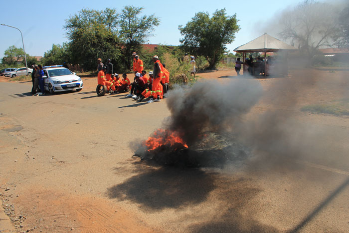 The protesters blocking the road with burning tyres last Friday