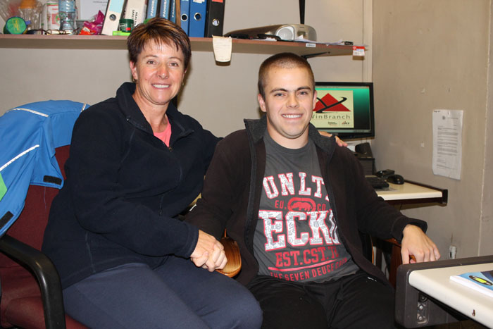 Mrs Heather Swartz and her son, Tyrone, at his workplace at Engen Fochville.