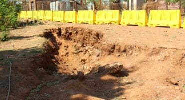 This sinkhole at the site of the old Badirile Secondary School is one of several in Khutsong that have only been cordoned off, but are not getting fixed.