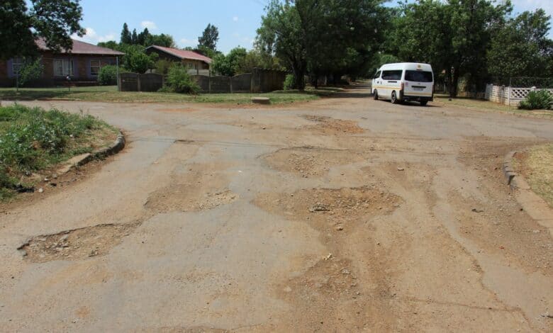 There are several deep potholes all over the intersection of Bosman and Du Preez Streets.