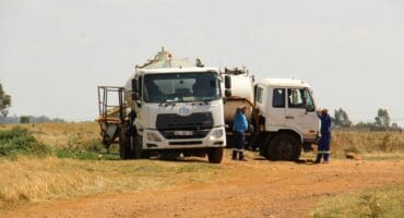 The drivers of two honey-sucker trucks dumping their contents into the manhole at approximately 14:20 on October 17.