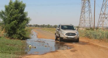 A motorist driving through some of the sewage leaking close to Hlanganani Primary School.